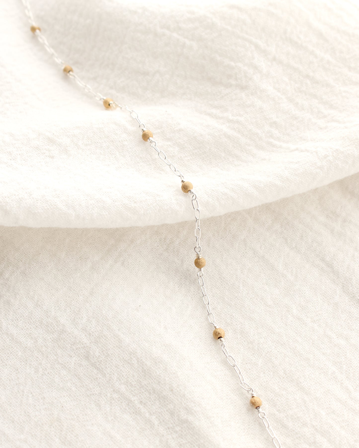 1.7mm Paperclip Chain with Gold Stardust Beads. M236