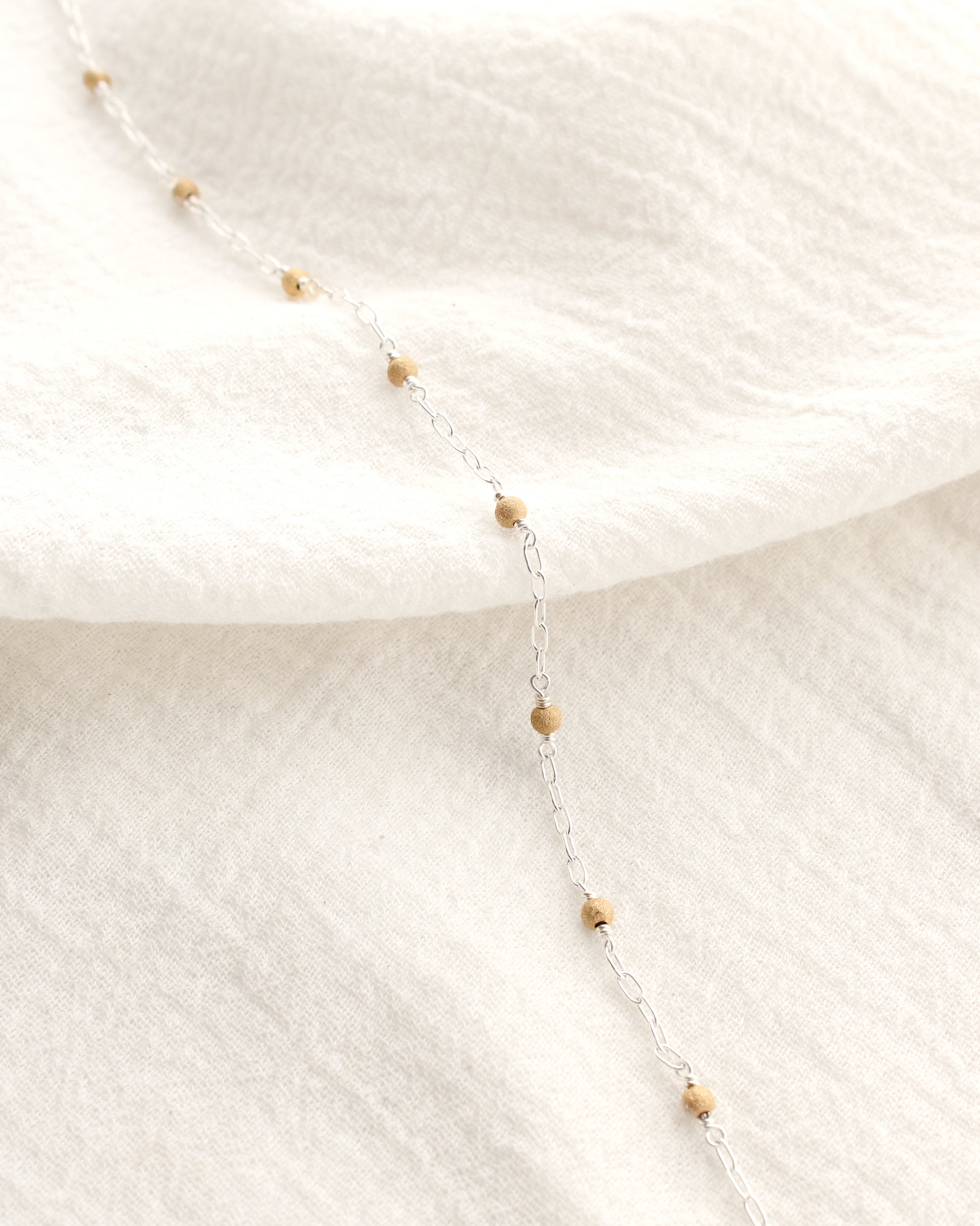 1.7mm Paperclip Chain with Gold Stardust Beads. M236