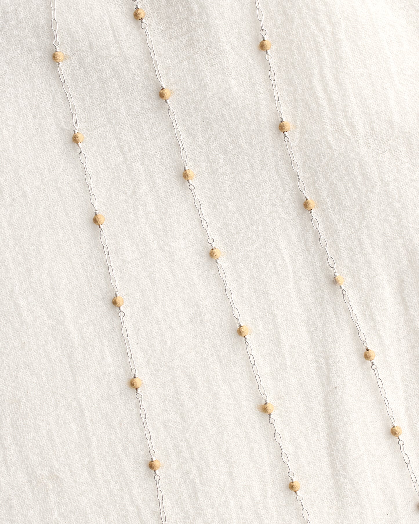 1.7mm Paperclip Chain with Gold Stardust Beads. M236