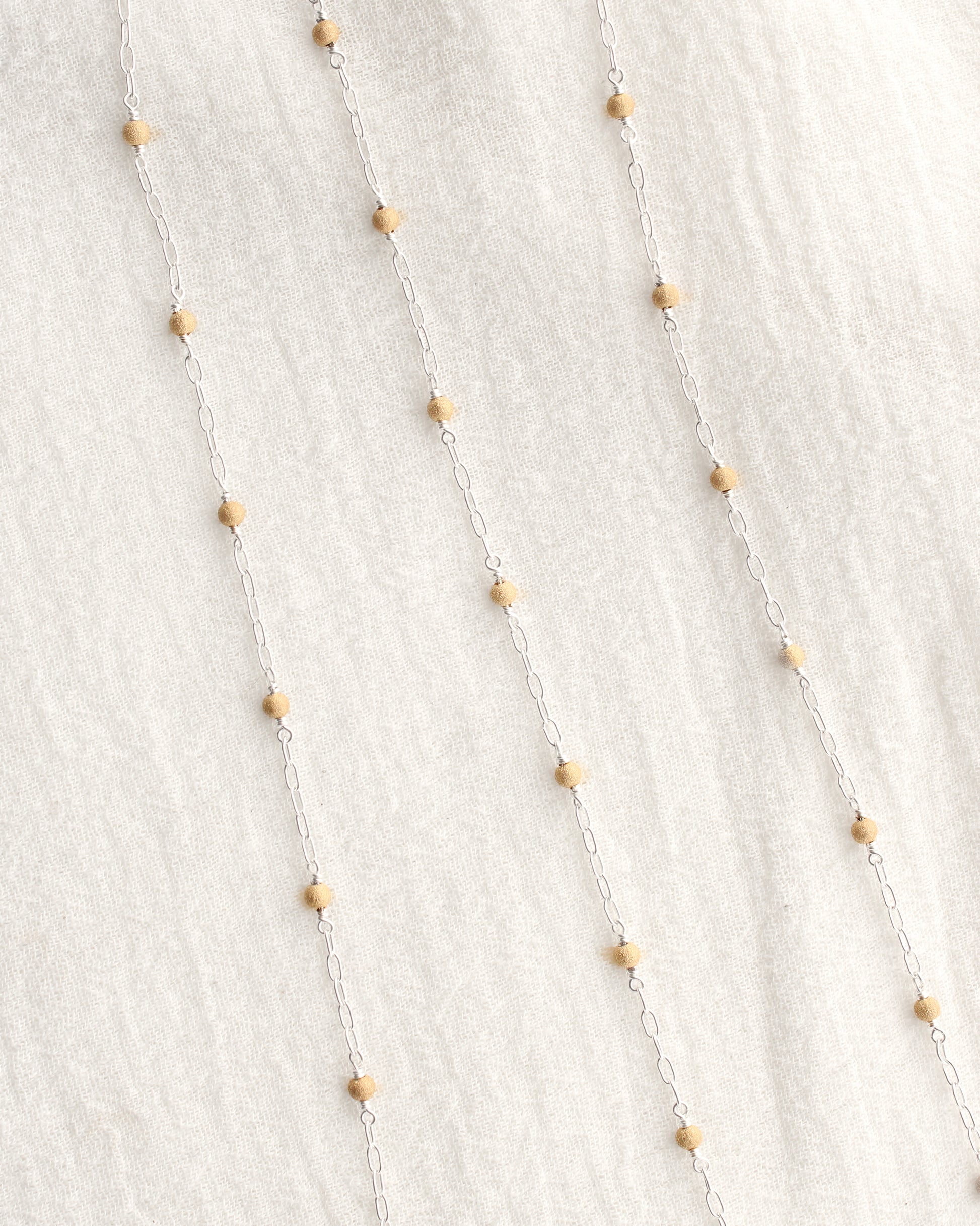 1.7mm Paperclip Chain with Gold Stardust Beads. M236