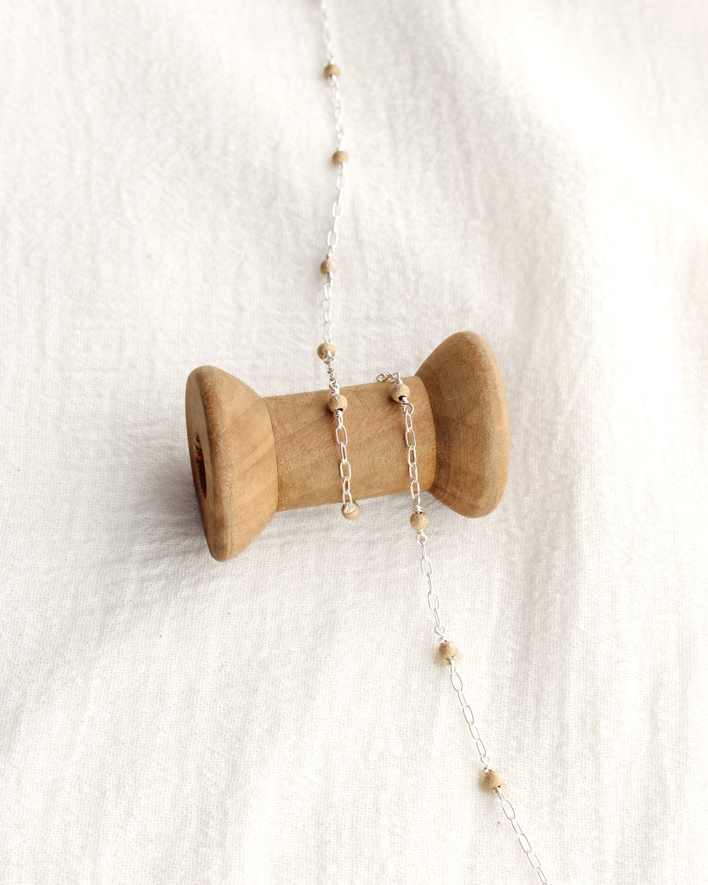 1.7mm Paperclip Chain with Gold Stardust Beads. M236