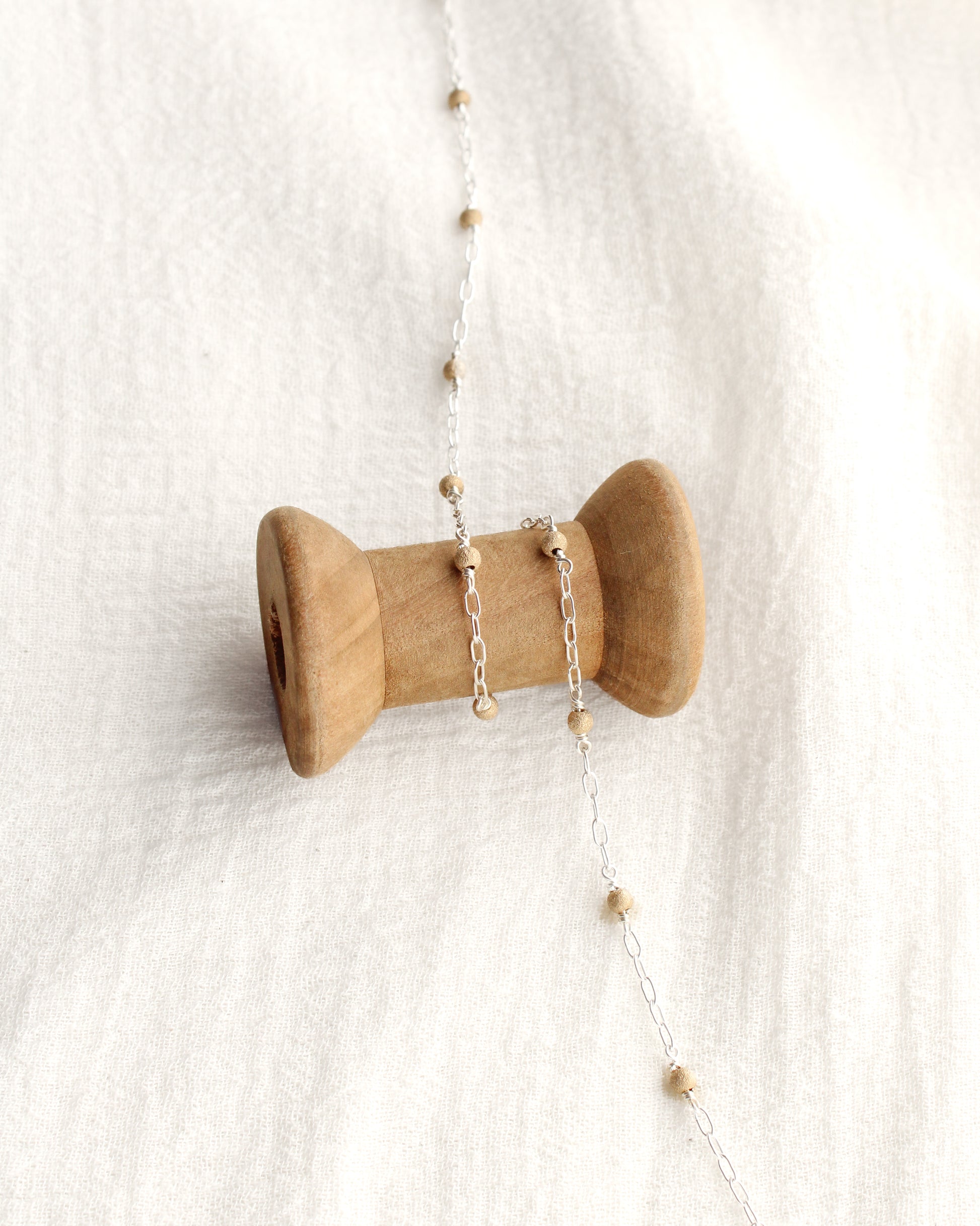 1.7mm Paperclip Chain with Gold Stardust Beads. M236