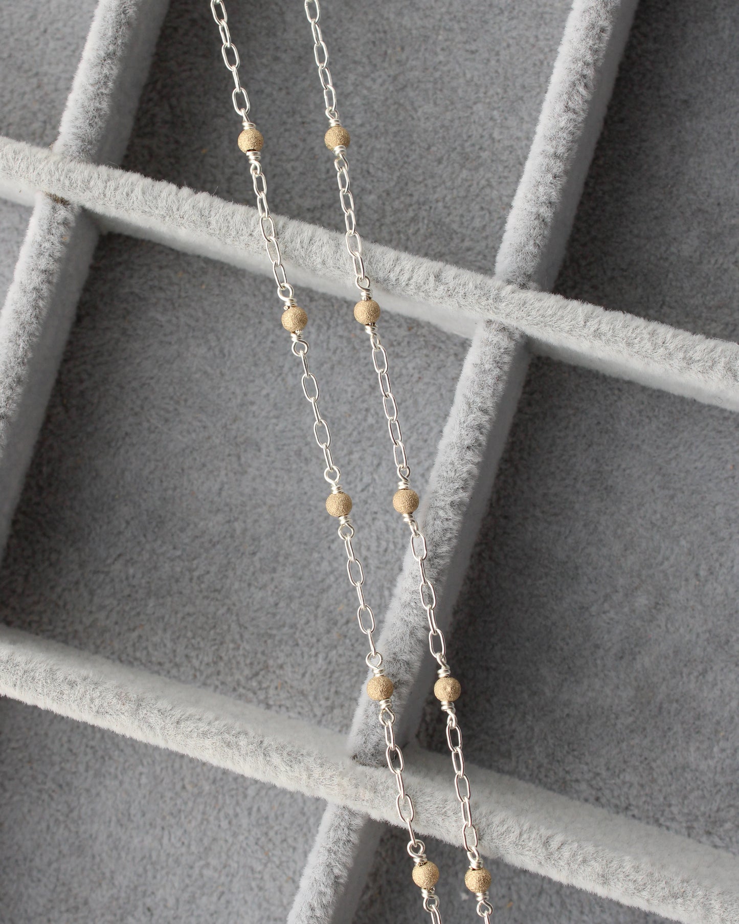 1.7mm Paperclip Chain with Gold Stardust Beads. M236
