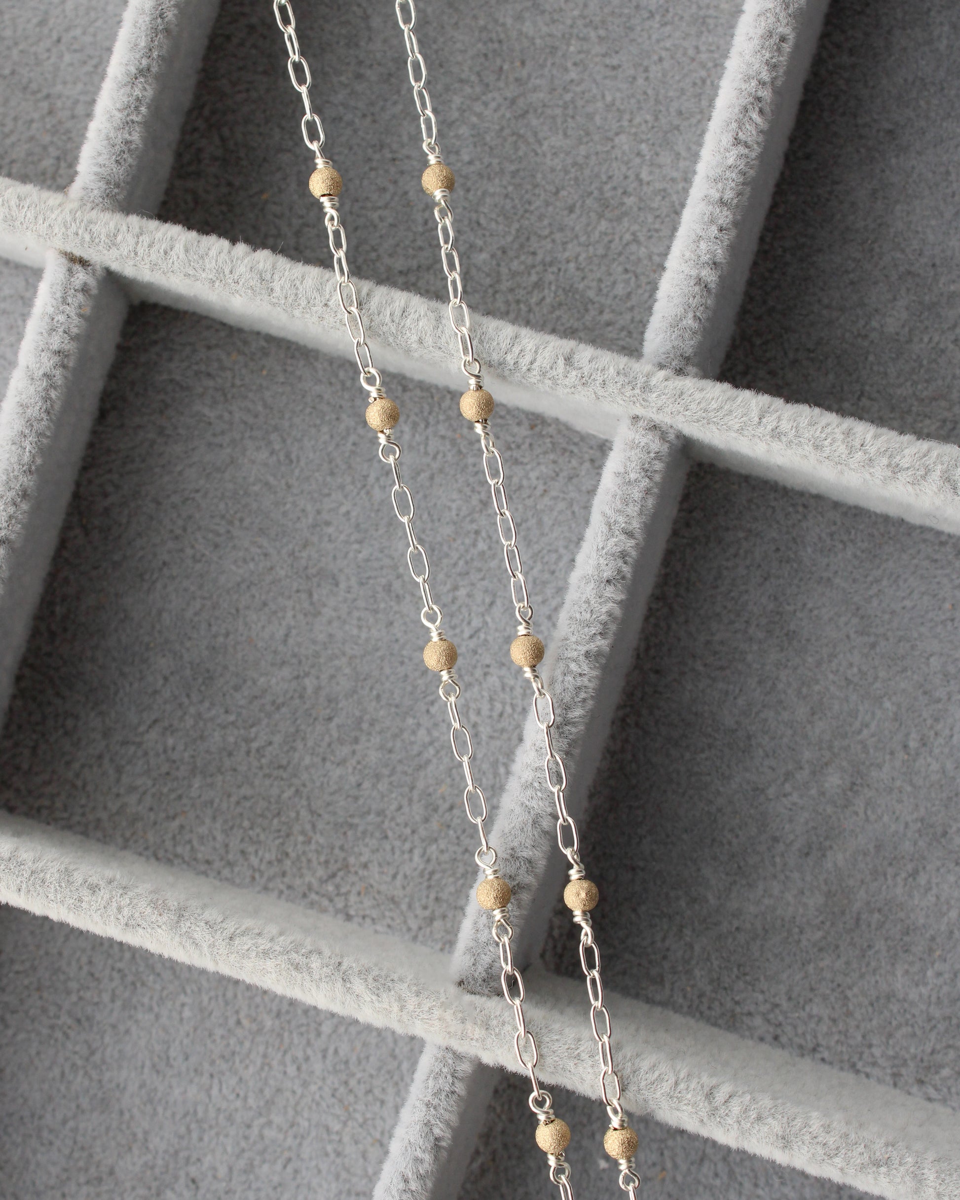1.7mm Paperclip Chain with Gold Stardust Beads. M236