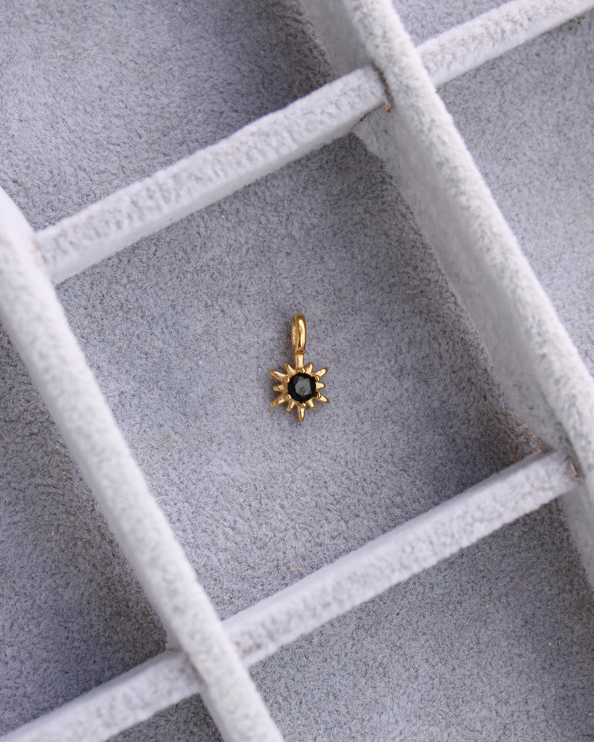 15mm Black Zircon Sunburst PVD Charm, CH369