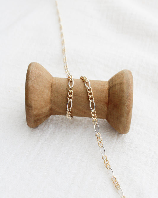 2.3mm Figaro Chain Silver w/ 3 Gold Links, M232